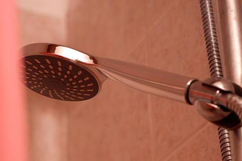 a shower head is hanging from a shower curtain at Casa Vacanza Gialu in Erchie