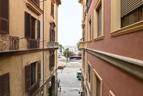 a view of an alley between two buildings at IzzHome The Breeze in Cagliari