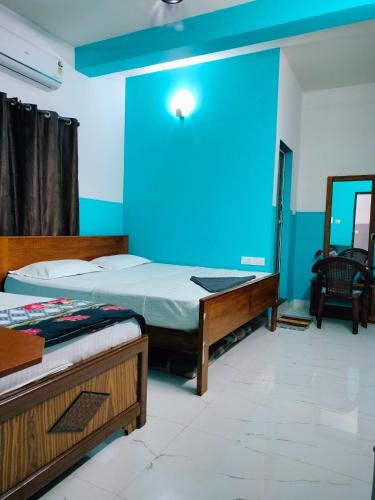Cama o camas de una habitación en Teja Residency