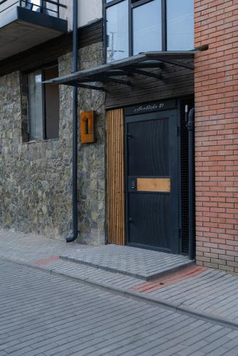 a building with a door on the side of it at Easy Rest in Tbilisi City