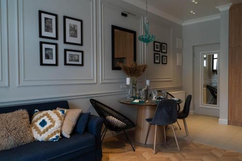 a living room with a couch and a table at Easy Rest in Tbilisi City