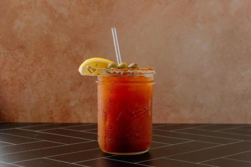a drink with a lemon on top of a table at Holiday Inn Resort Grand Cayman by IHG in George Town
