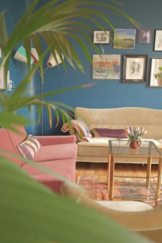 a living room with a couch and a table at Huset i Hejls in Hejls