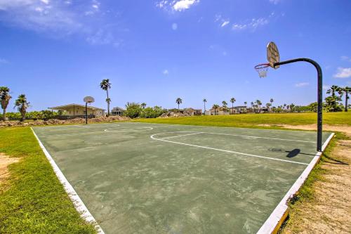 a basketball court with a hoop in a park at Canalfront Port Isabel Cottage 5 Mi to Beach! in Port Isabel