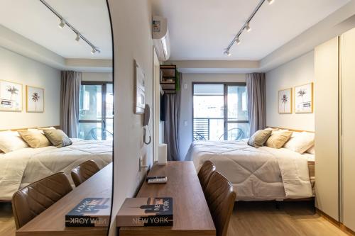 Cama ou camas em um quarto em 360 Ambience Vila Mariana