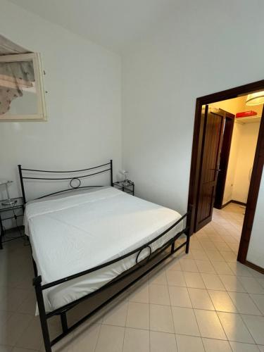 a bedroom with a bed in a room at Casa vacanza La Sciumara in Palau