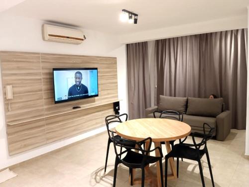 a living room with a table and a couch at Alójate 12 - Moderno y luminoso - 4 o 2 personas Zona Hospital Español-Estadio Unico in La Plata