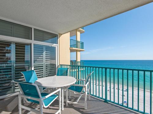 a balcony with a table and chairs and the ocean at Jade East Towers 1050 by Newman-Dailey in Destin