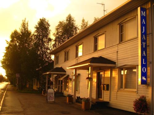 a building with a sign in front of it at Guesthouse Golden Goose in Kittilä