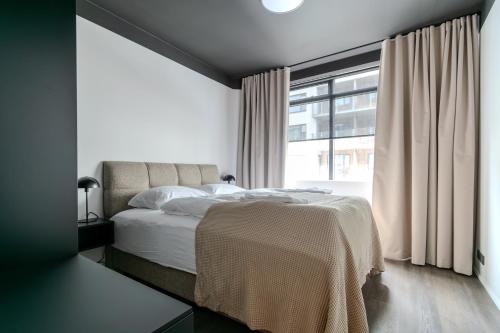 Postel nebo postele na pokoji v ubytování B2 Apartments by Heimaleiga