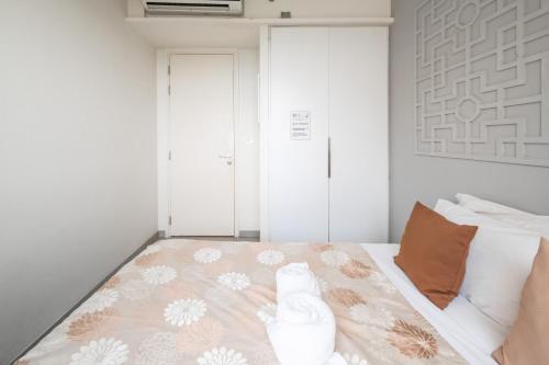 Postel nebo postele na pokoji v ubytování Unixx Pattaya by Alvin