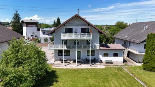an aerial view of a white house with a balcony at Apartment Attergautraum 1 in Sankt Georgen im Attergau