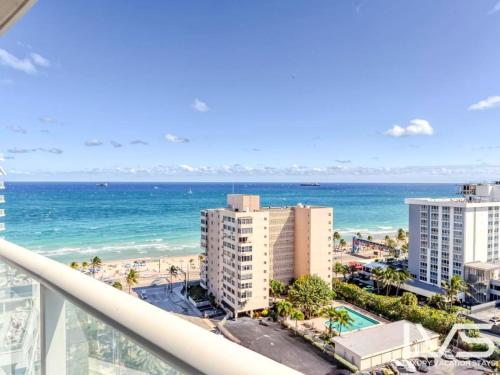 a view of the beach from the balcony of a building at W FTL 1409 Beachfront Resort 2 Bedroom & 2 Bathroom Condo in Fort Lauderdale