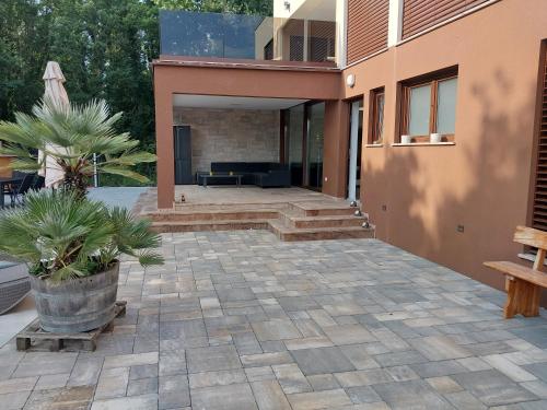 a house with a stone patio with a fireplace at Villa Sunce Funtana in Funtana