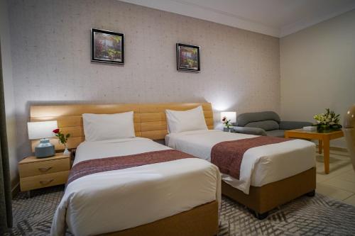 Letto o letti in una camera di Emaar Al Noor
