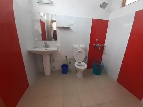 a bathroom with a toilet and a sink at Reeyork House - By Konchok a native Ladakhi in Leh