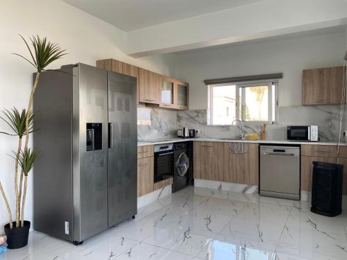 Η κουζίνα ή μικρή κουζίνα στο Sant Central Deluxe Apartments