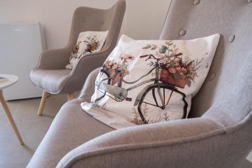 a pillow with a bicycle on it sitting on a chair at Villa la sorgente in Guardia Vomano
