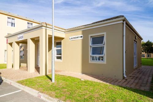a building with a street sign in front of it at Funky 2bed apartment with multipurpose room! in Cape Town