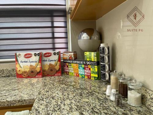 a kitchen counter with some food on top of it at Suite FG in San Juan de los Lagos
