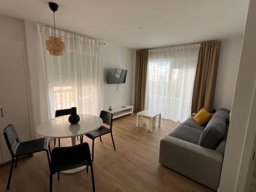 a living room with a couch and a table at Apartamento San Antonio 1 in Carboneras