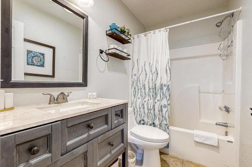a bathroom with a sink and a toilet and a shower at Simplify #1F in Frisco
