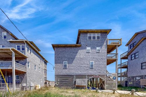 a large house with a gambrel roof at Simplify #1F in Frisco