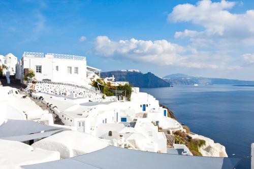 a view of the amalfi coast with white buildings and the water at Alexander's Suites in Oia