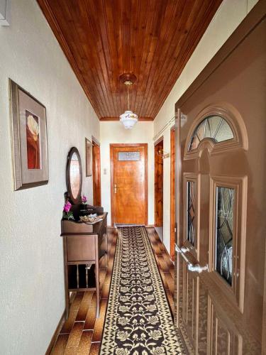 a hallway of a home with a wooden door at Rustic House in Miléa