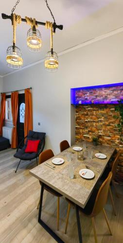 a dining room with a table and chairs at Allin home in Mantoúkion