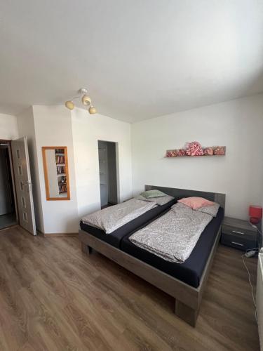 a bedroom with a bed in a room at -Self-Check- 4-bedroom family house with heated tub in Levice
