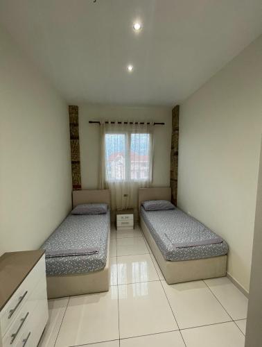 Postel nebo postele na pokoji v ubytování Franco Apartments