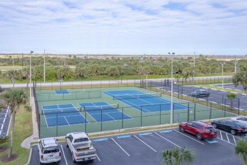 an aerial view of a tennis court in a parking lot at Islander East Condominiums in Galveston
