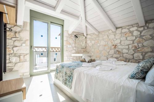 Кровать или кровати в номере Villa Maria Vasilikos