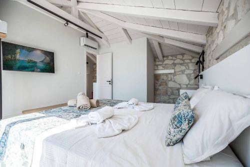 Кровать или кровати в номере Villa Maria Vasilikos