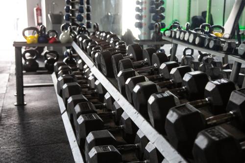 a row of dumbbells in a gym at Broad Larch Lodge in Bowness-on-Windermere