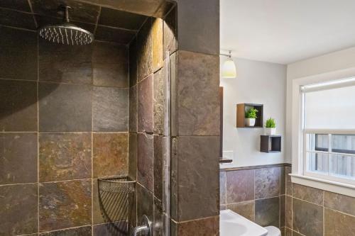 a bathroom with a shower and a sink at Beachside Retreat! Cozy 1-bedroom W Private Yard in Dennis