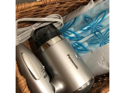 a wicker basket with a hair dryer in it at Hotel Sunset Hill - Vacation STAY 94797v in Nakadomari