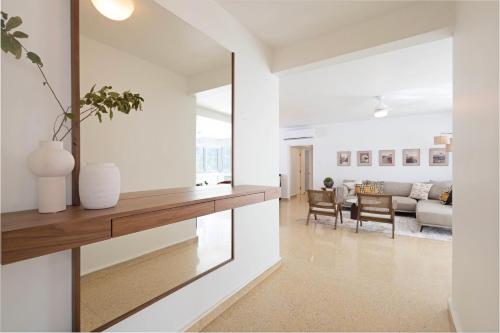 a living room with white walls and a large window at Hidden Gem In Miramar- Power Generator- Parking in San Juan