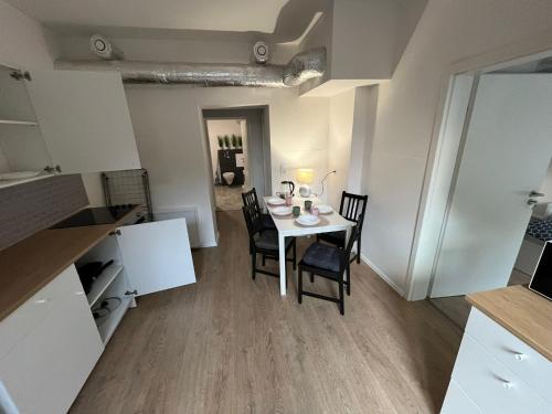 a kitchen and dining room with a table and chairs at Top Apartments in Kamen - Cozystays in Kamen