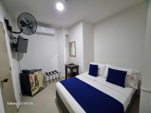 Postel nebo postele na pokoji v ubytování Hotel Casa 10