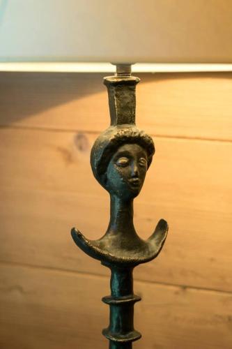 a black pole with a statue of a face on it at Gstaad - Great Luxurious Farmhouse in Kalberhöni