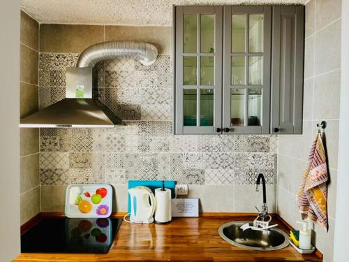 a kitchen with a sink and a counter top at Sea lover's nest in Los Realejos