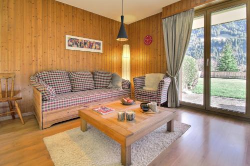 a living room with a couch and a coffee table at Val Air E53 Terrace & Relaxation in Champéry