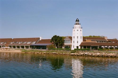 a lighthouse on the shore of a body of water at Montauk Yacht Club in Montauk