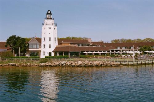 a lighthouse on the shore of a body of water at Montauk Yacht Club in Montauk
