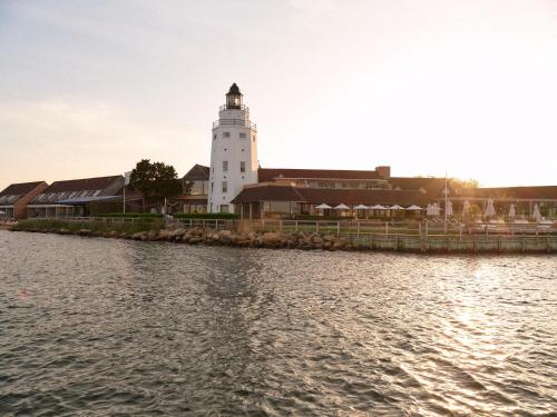a lighthouse on the shore of a body of water at Montauk Yacht Club in Montauk