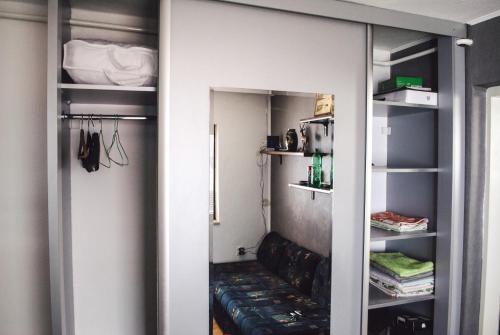 a walk in closet with a couch in it at Guest house Nizama's Place in Sarajevo