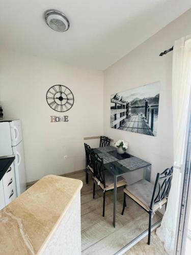 a kitchen and dining room with a table and chairs at Villa Norah in Podgora