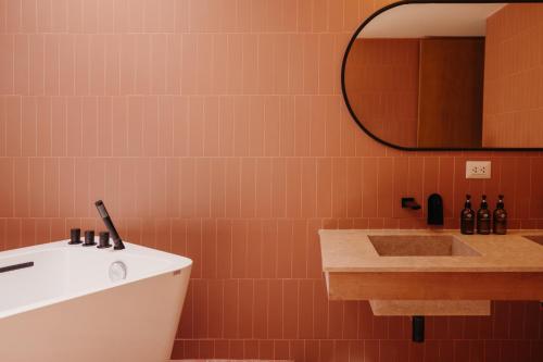a bathroom with a sink and a mirror at La Posada del Puente in Arequipa